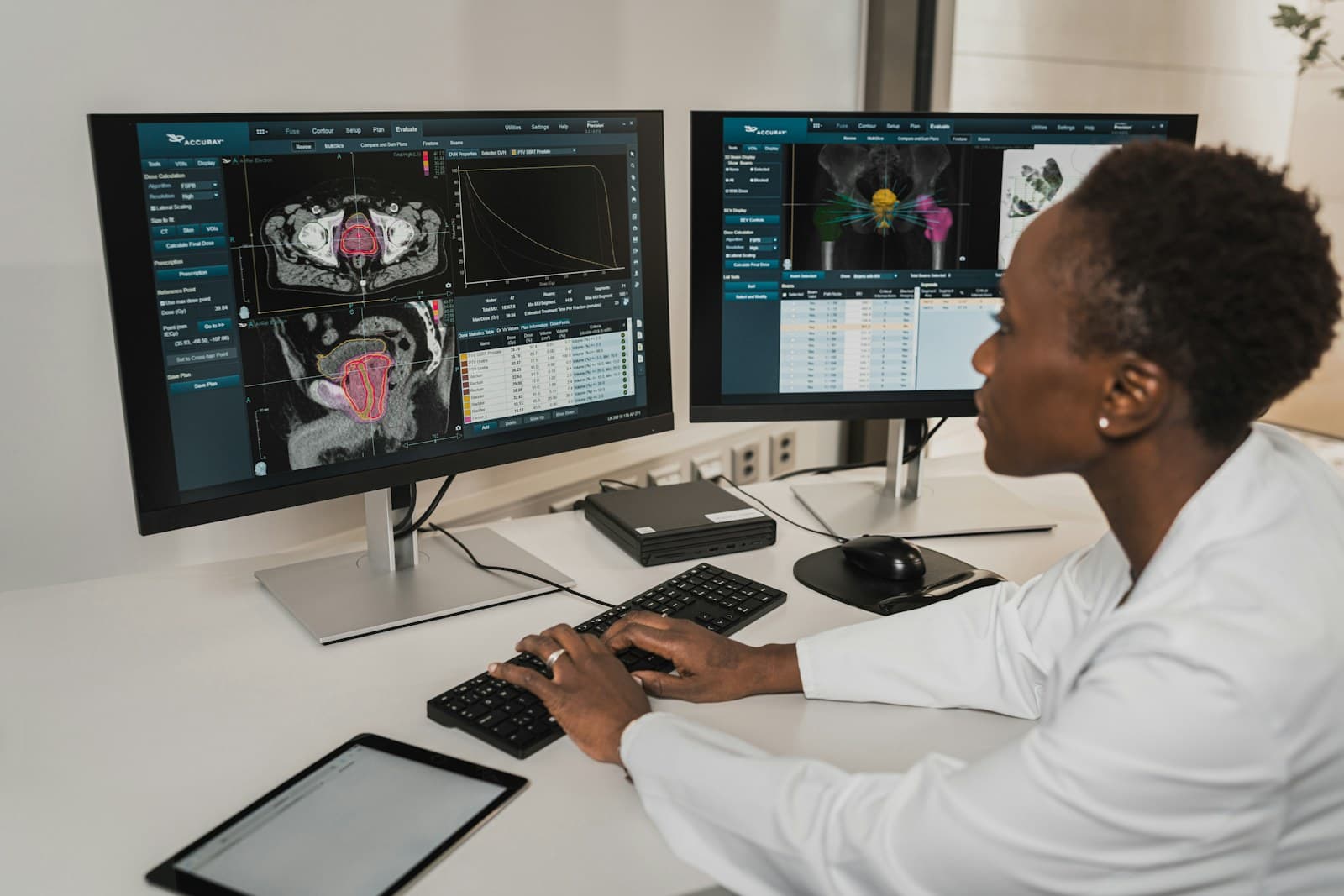 Physician reviewing a patient chart at a workstation