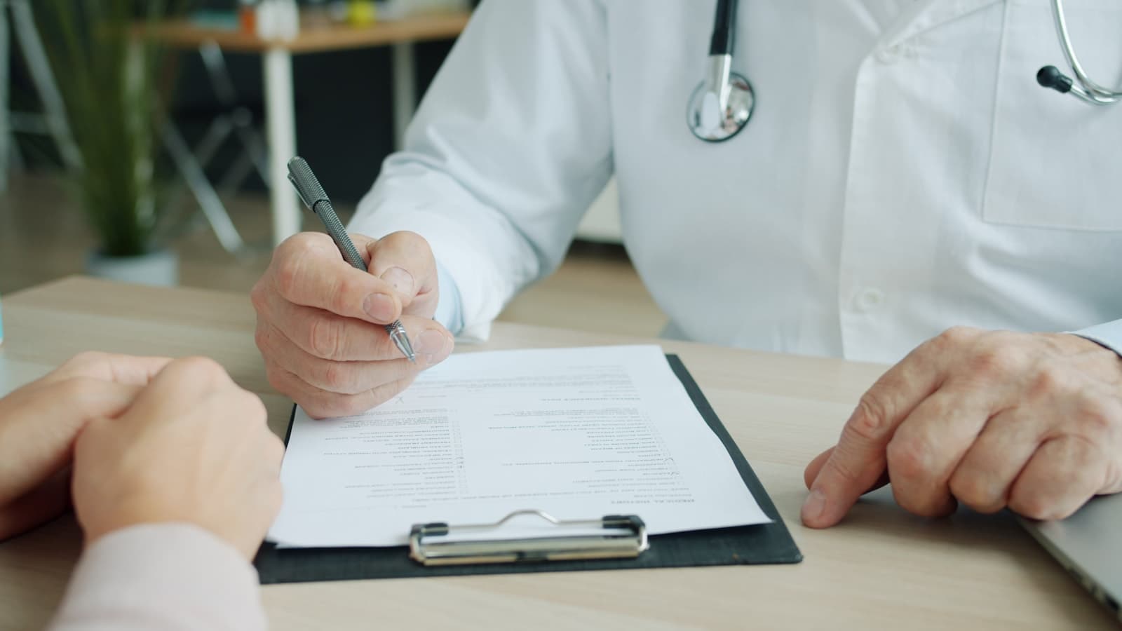 Clinician examining data in a medical report